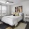 a bedroom with a bed and a table