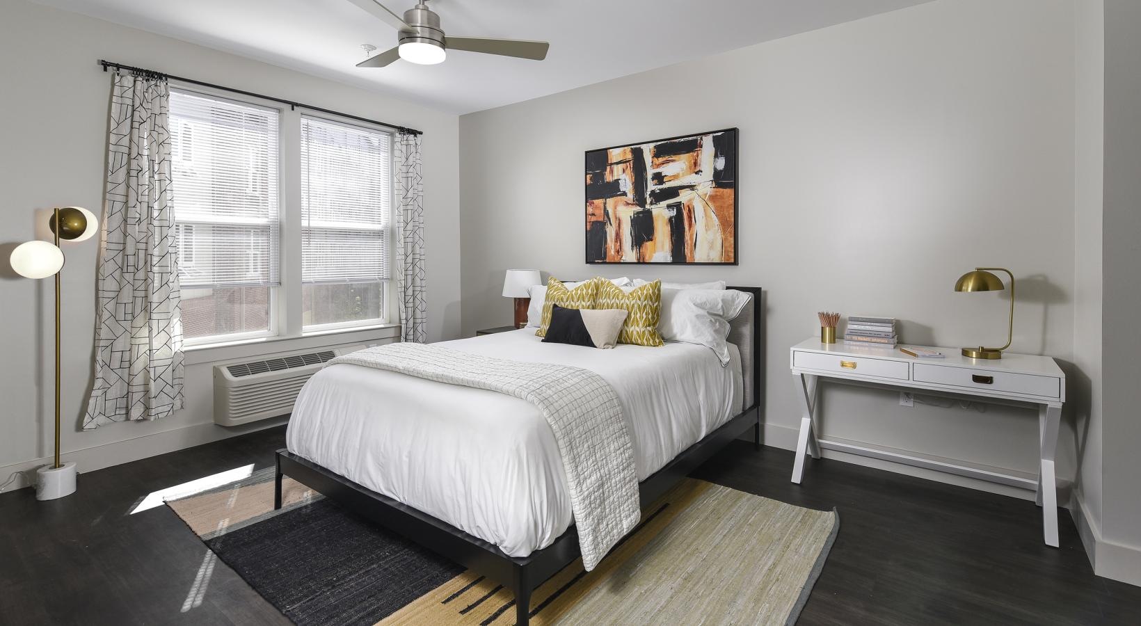 Generous bedroom offerings to fit every family a bedroom with a bed and a table