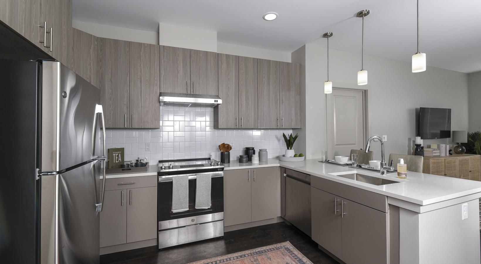 Beautiful kitchens with designer finishes a kitchen with a red rug