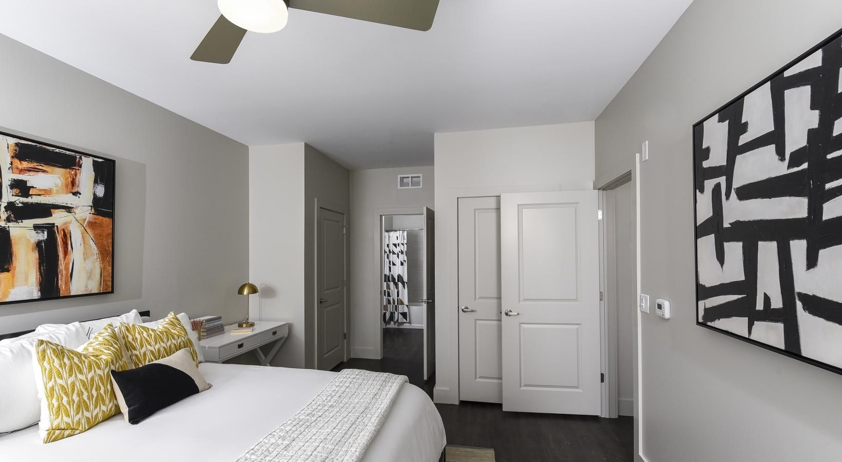 Sleep in style a bedroom with a bed and a fan
