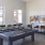 a clubroom with a pool table and chairs