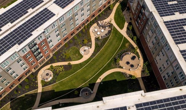 a building with a courtyard and trees