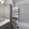 a bathroom with a tub sink and shower