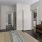 a room with a bed and a dresser