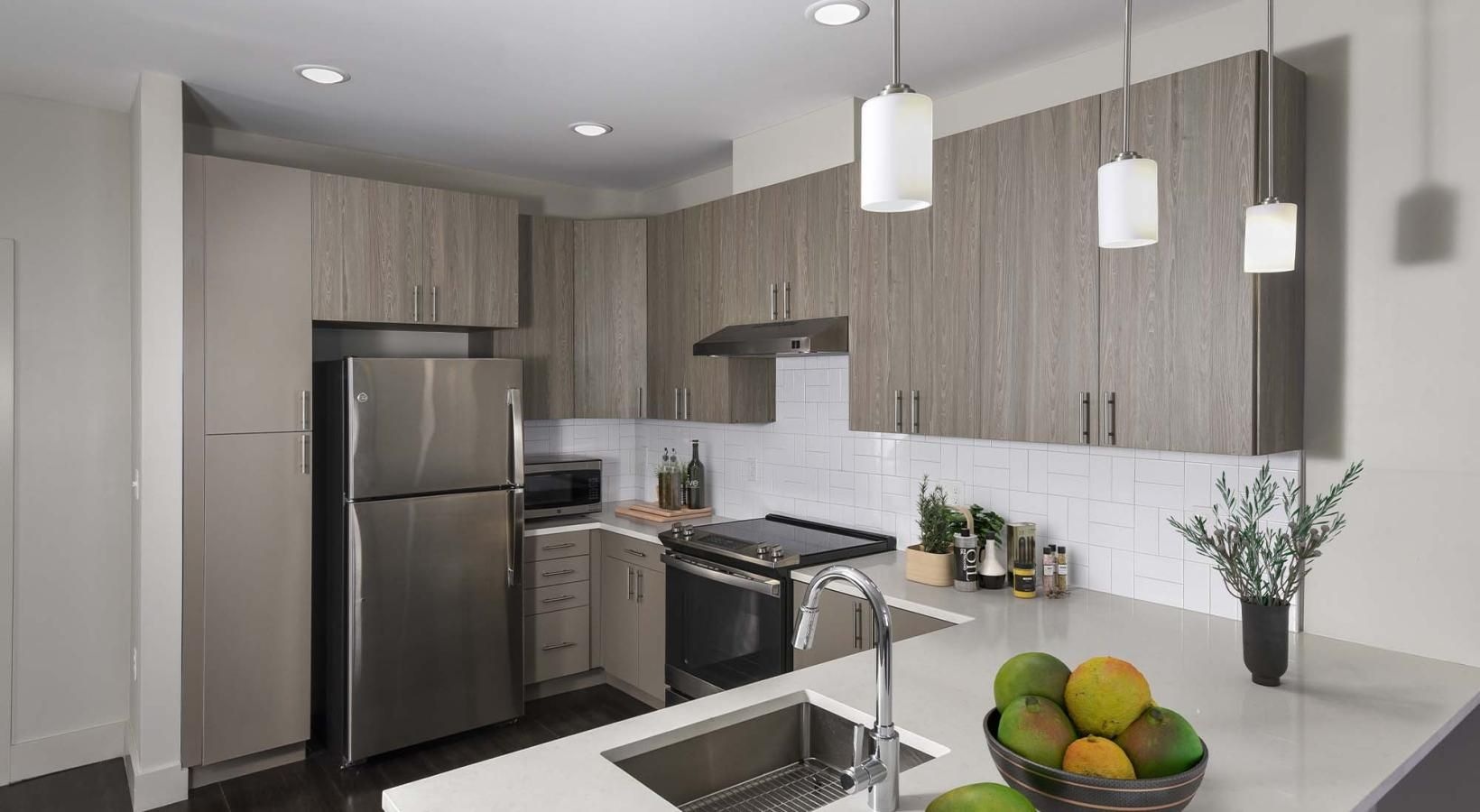 Spacious kitchens with thoughtful details a kitchen with a marble counter top