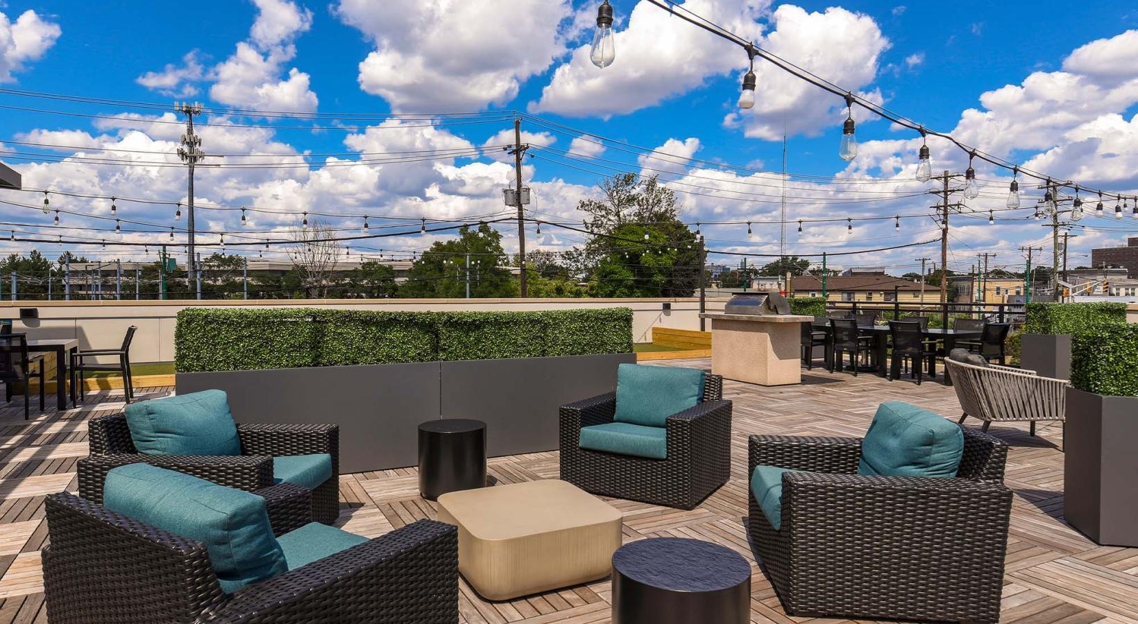 Cutting-edge amenities at your fingertips a patio with chairs and tables