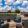 a patio with chairs and tables