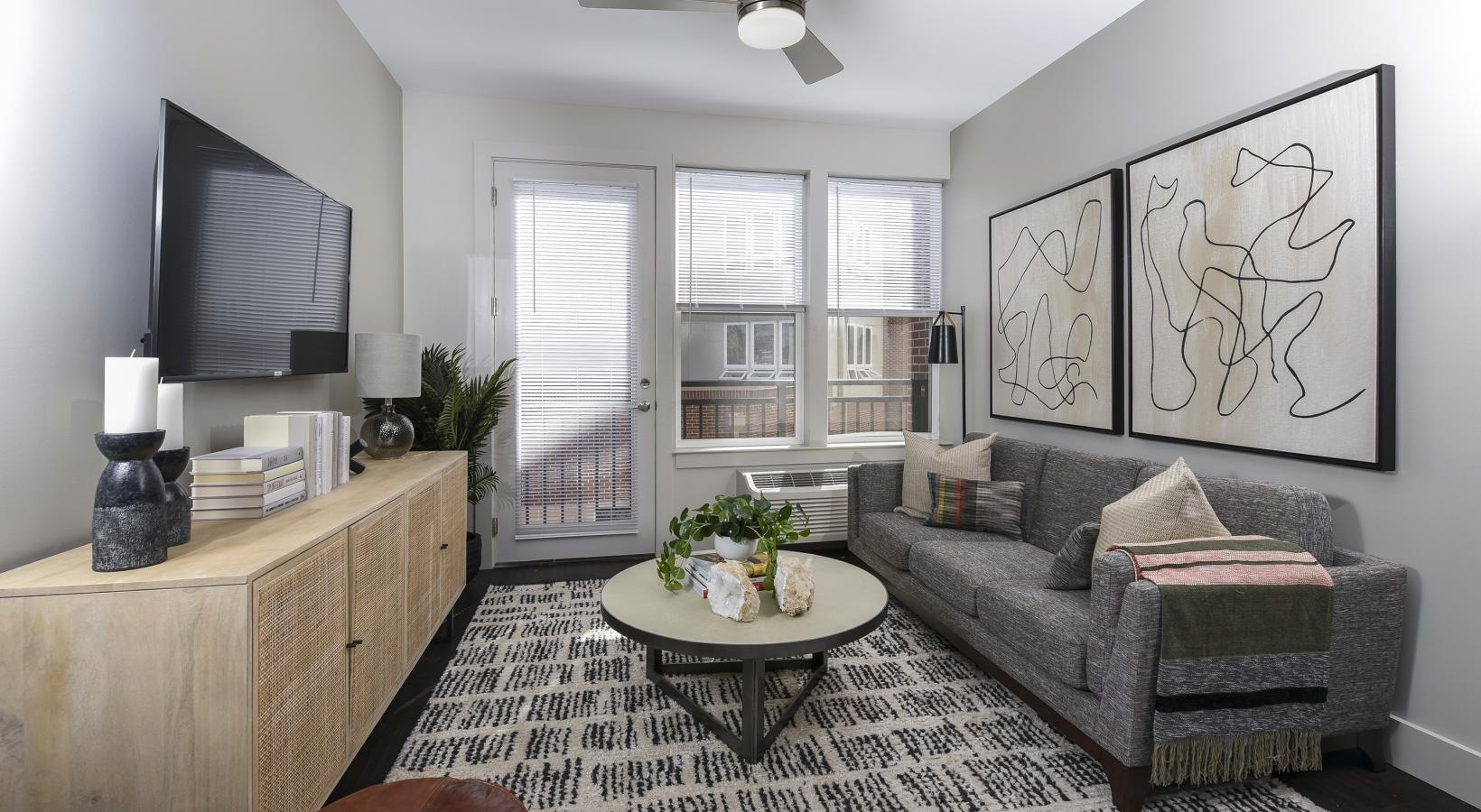 Wide open living areas flooded with natural light a living room with a couch and a table