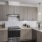 a kitchen with white cabinets