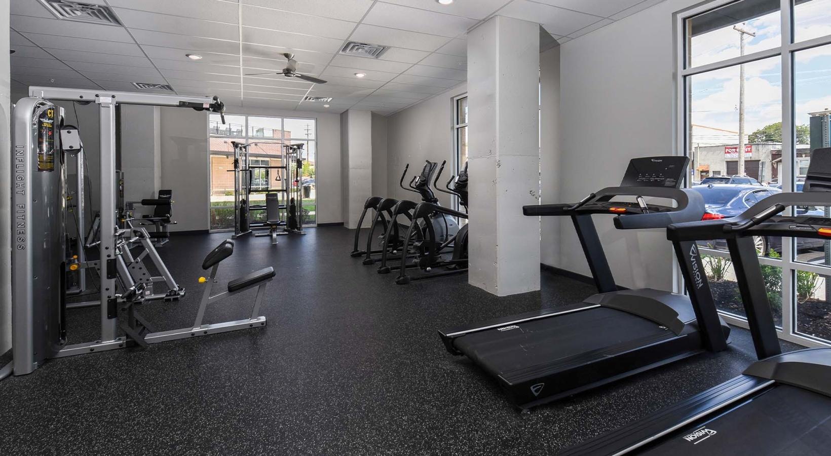 State-of-the-art amenities a gym with exercise equipment