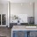 a clubroom kitchen with a bar and chairs