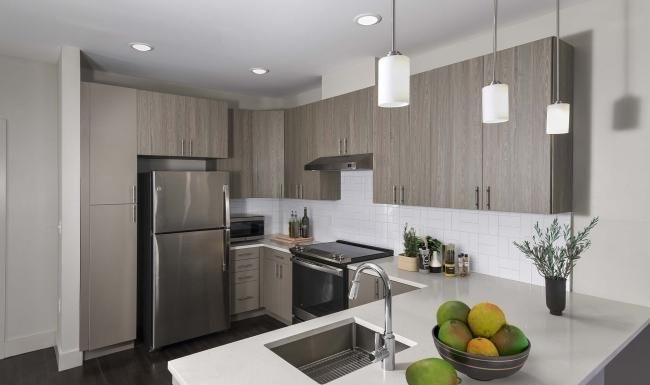 a kitchen with a marble counter top