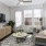 a living room with a couch and a table